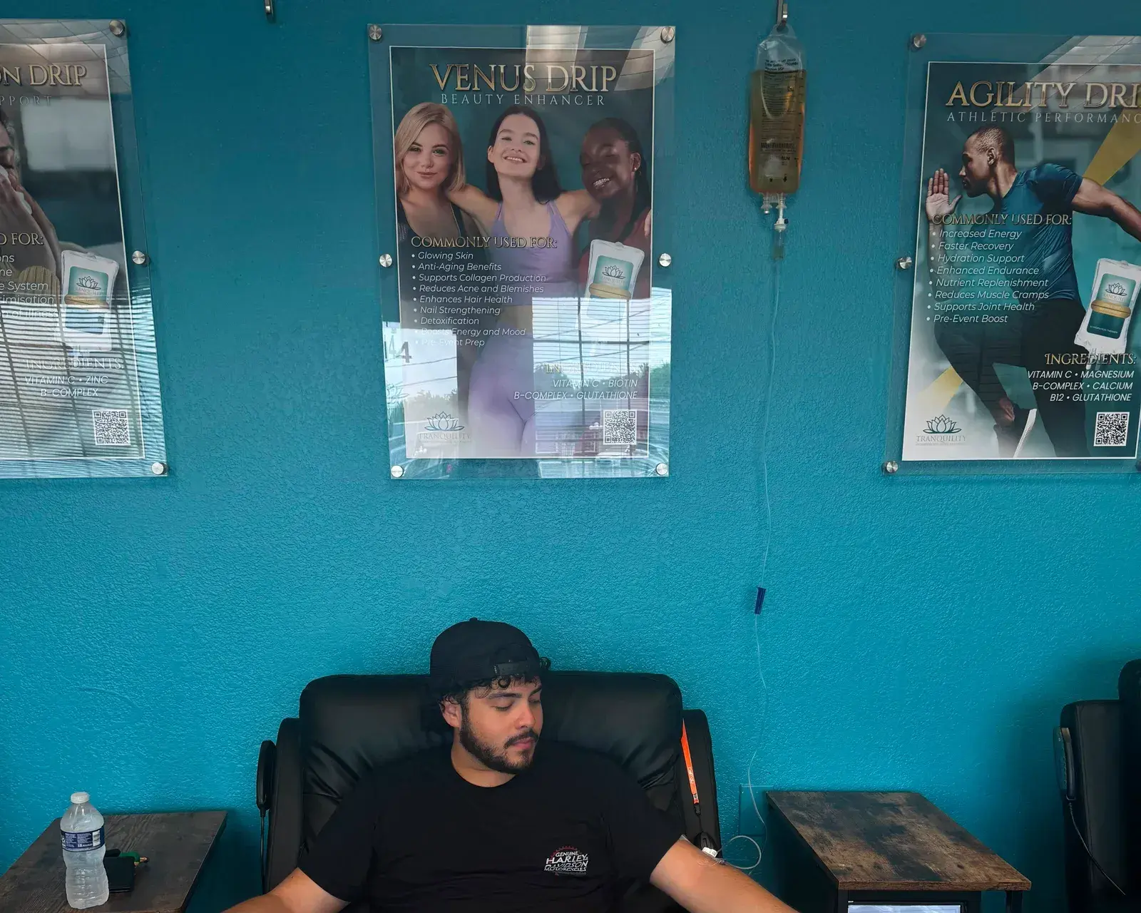A guest resting in a reclining chair at Tranquility while receiving an intravenous infusion
